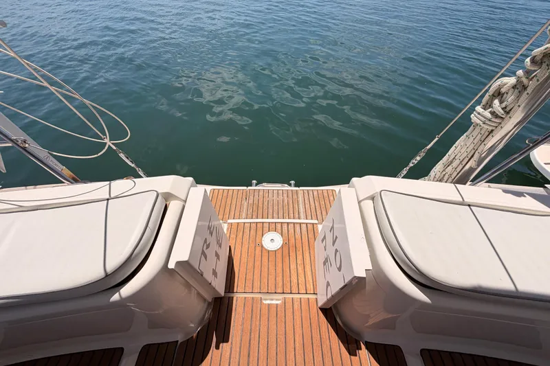 Slide: The Image of Jeanneau Sun Odyssey 45.2 yacht deck, 1999 model, overlooking calm water. - 25