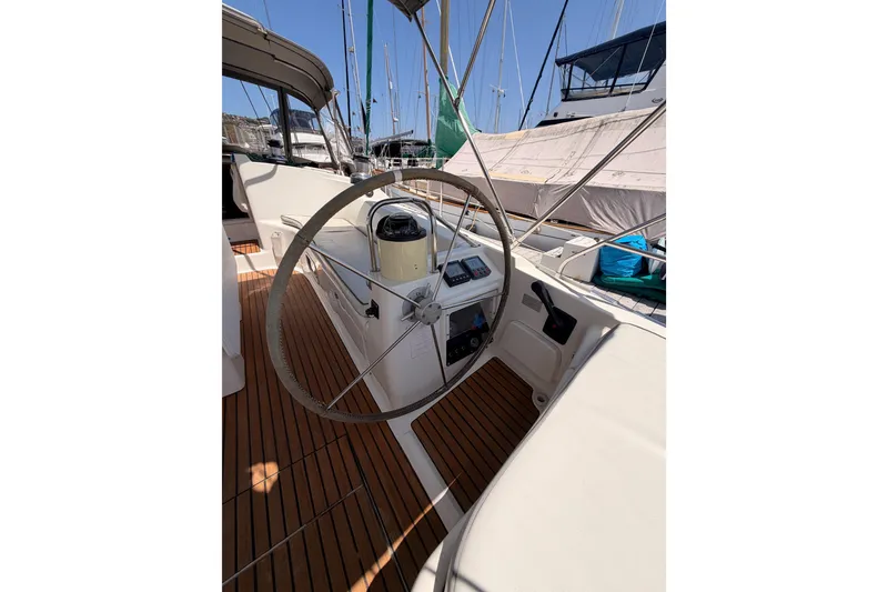 Slide: The Image of Cockpit of 1999 Jeanneau Sun Odyssey 45.2 sailboat with wooden deck and steering wheel. - 29