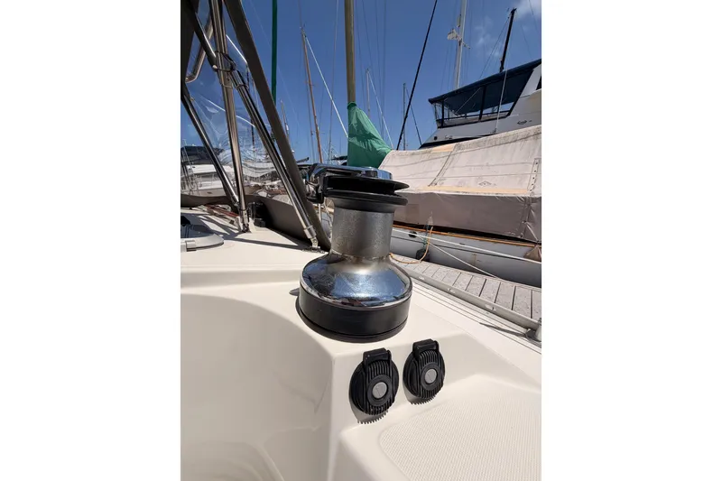 Slide: The Image of Jeanneau Sun Odyssey 45.2 sailboat deck with winch, 1999 model, docked at marina. - 35