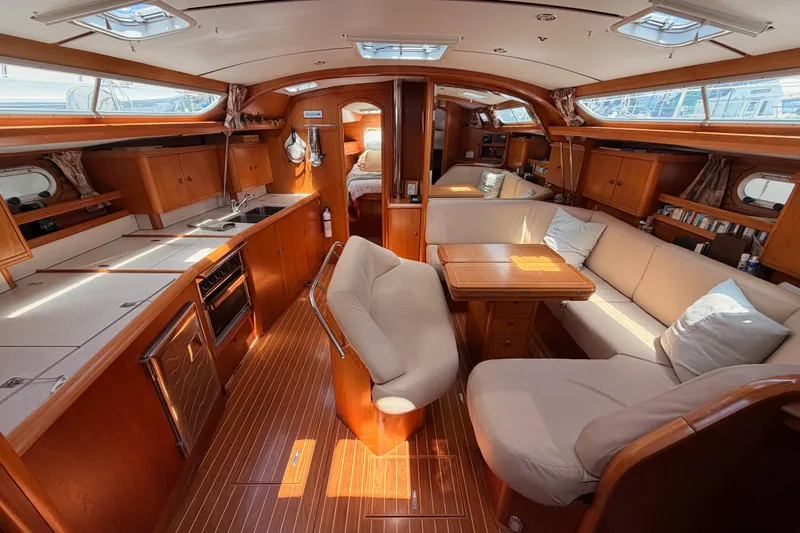 Slide: The Image of Luxurious interior of 1999 Jeanneau Sun Odyssey 45.2 yacht with elegant wood finish. - 37
