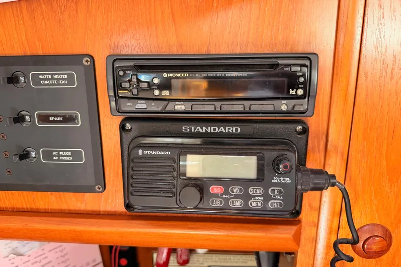 Slide: The Image of Control panel with Pioneer stereo and Standard radio on Jeanneau Sun Odyssey 45.2, 1999 model. - 44