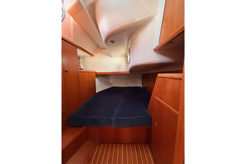 Slide: The Image of Interior cabin of 1999 Jeanneau Sun Odyssey 45.2 sailboat with wooden cabinetry. - 46