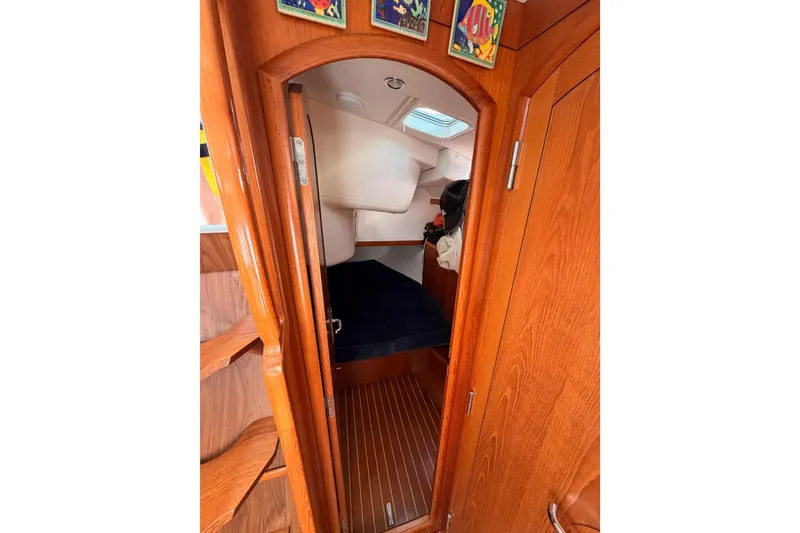 Slide: The Image of Interior cabin view of 1999 Jeanneau Sun Odyssey 45.2 sailboat with wooden finish. - 52