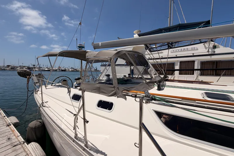Slide: The Image of Jeanneau Sun Odyssey 45.2 sailboat docked at marina, 1999 model, clear sky. - 7