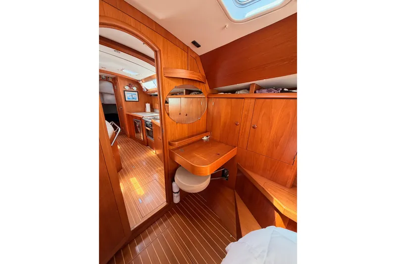 Slide: The Image of Interior of 1999 Jeanneau Sun Odyssey 45.2 yacht with wooden cabinetry and cozy design. - 72