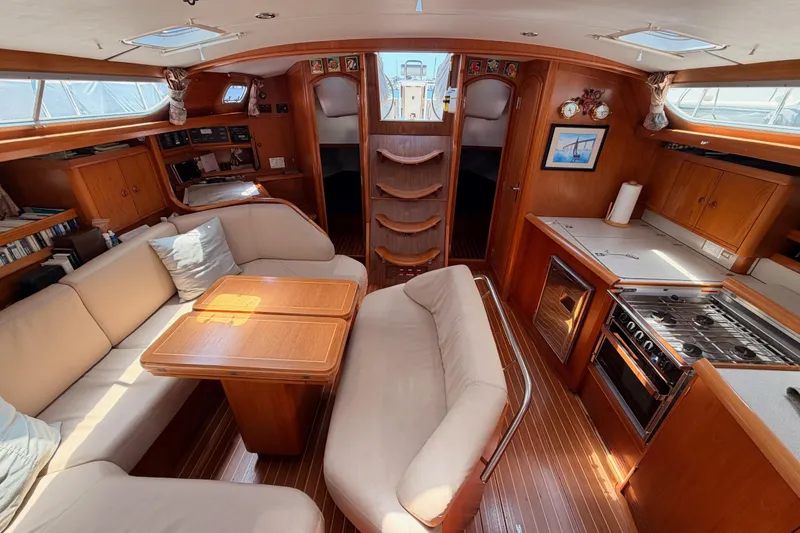 Slide: The Image of Interior of 1999 Jeanneau Sun Odyssey 45.2 yacht with cozy seating and modern kitchen. - 75
