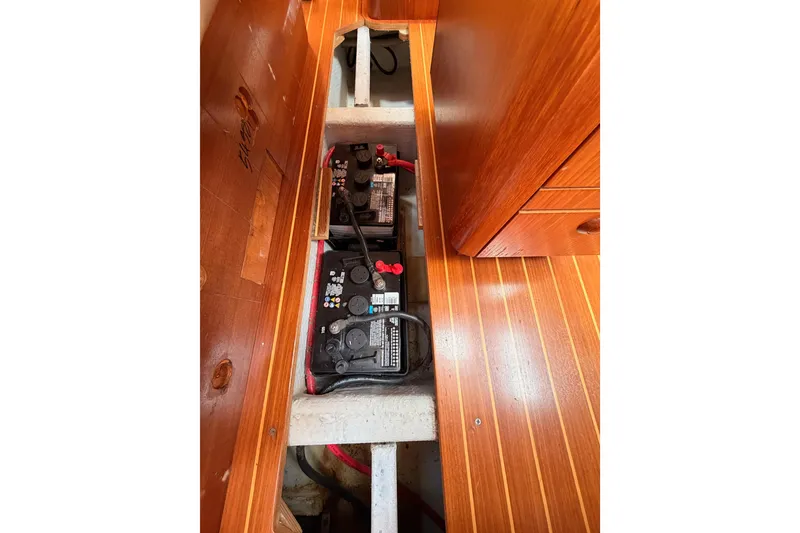 Slide: The Image of Battery compartment of 1999 Jeanneau Sun Odyssey 45.2 sailboat with wooden flooring. - 78