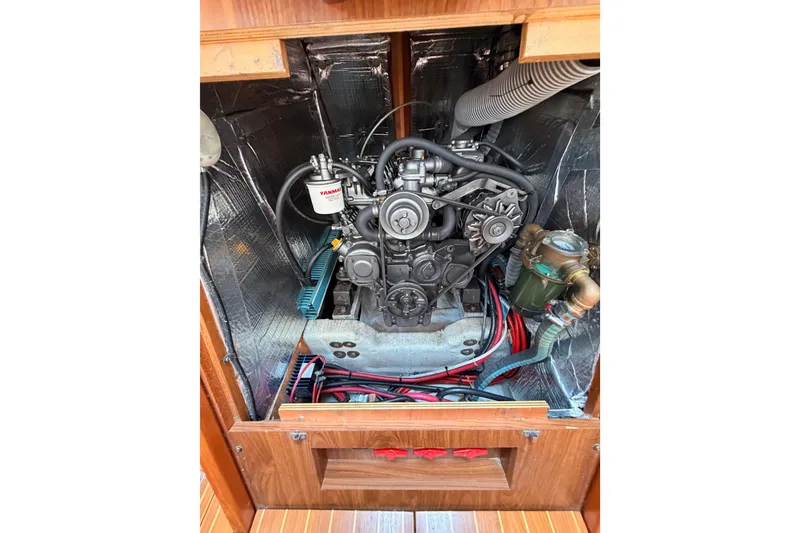 Slide: The Image of Engine compartment of 1999 Jeanneau Sun Odyssey 45.2 sailboat, featuring Yanmar engine. - 79