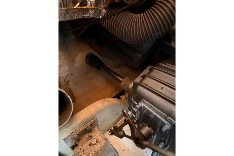 Slide: The Image of Engine compartment of 1999 Jeanneau Sun Odyssey 45.2 sailboat, showing mechanical components. - 82
