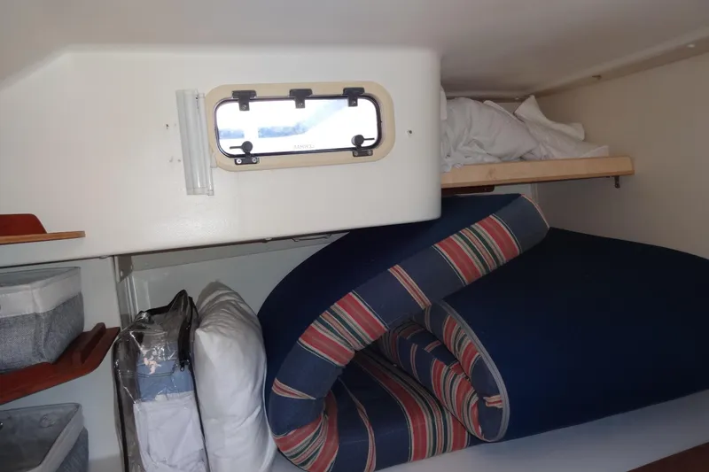 Slide: The Image of Interior cabin of a 1996 Lagoon 35 CCC yacht with bedding and storage. - 106