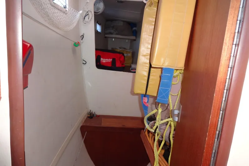 Slide: The Image of Interior of 1996 Lagoon 35 CCC sailboat with storage and safety equipment. - 113