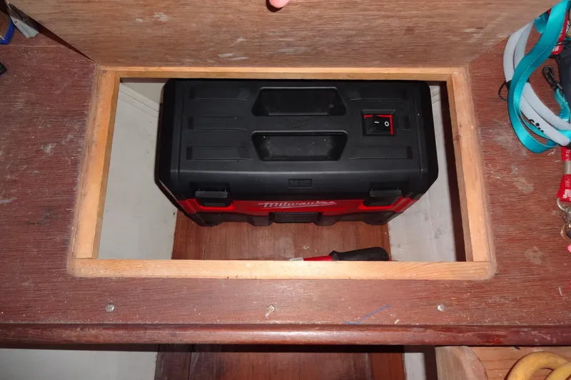 Slide: The Image of Toolbox stored in a wooden compartment on a 1996 Lagoon 35 CCC boat. - 115