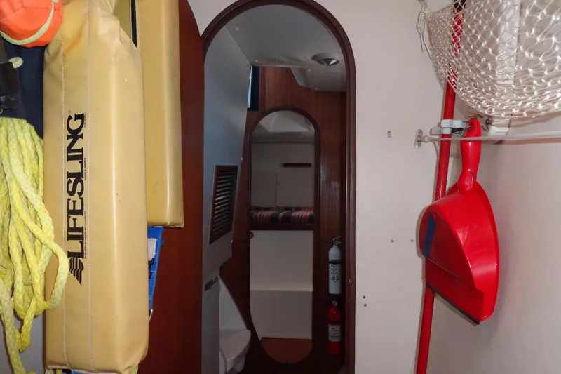 Slide: The Image of Interior of a 1996 Lagoon 35 CCC sailboat with safety equipment and storage. - 116