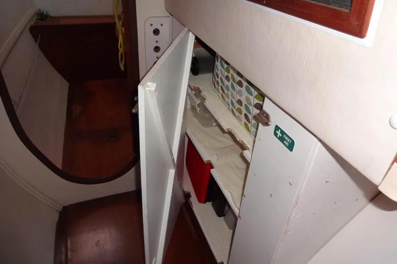 Slide: The Image of Interior of 1996 Lagoon 35 CCC showing open cabinet with first aid supplies. - 117