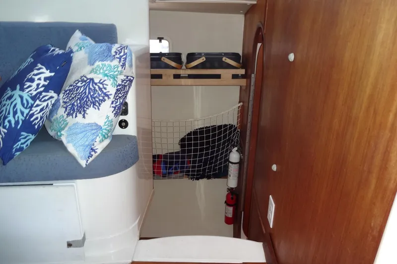 Slide: The Image of Interior of 1996 Lagoon 35 CCC yacht with cushions and storage area. - 120