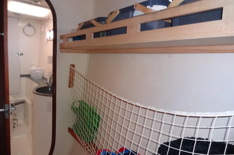 Slide: The Image of Interior of 1996 Lagoon 35 CCC yacht showing bathroom and storage area. - 122