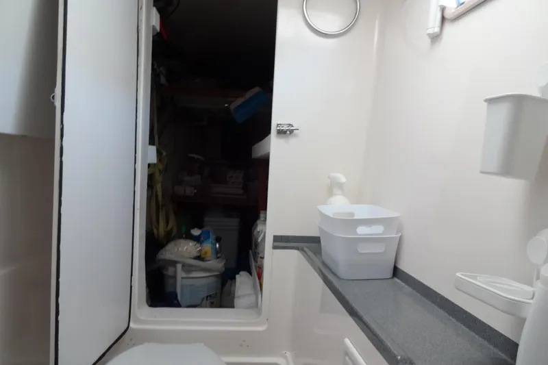 Slide: The Image of Interior of 1996 Lagoon 35 CCC yacht bathroom with storage area. - 125