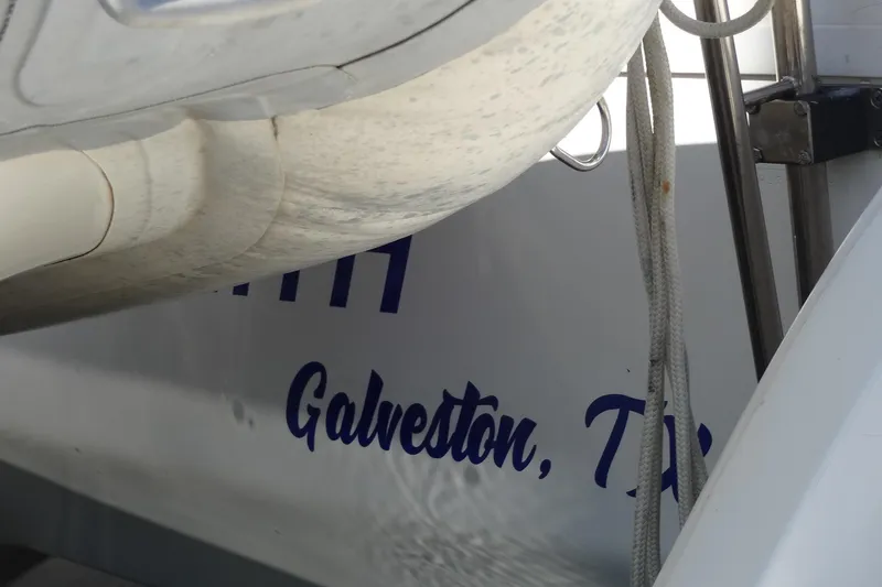 Slide: The Image of Sailboat detail showing "Galveston, TX" on a 1996 Lagoon 35 CCC. - 29