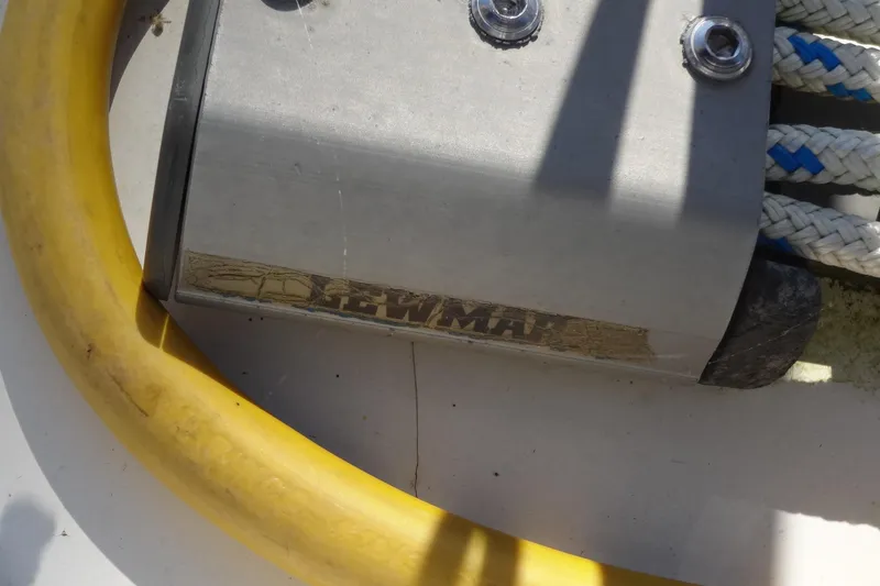 Slide: The Image of Close-up of a Lagoon 35 CCC 1996 boat component with yellow hose and ropes. - 35