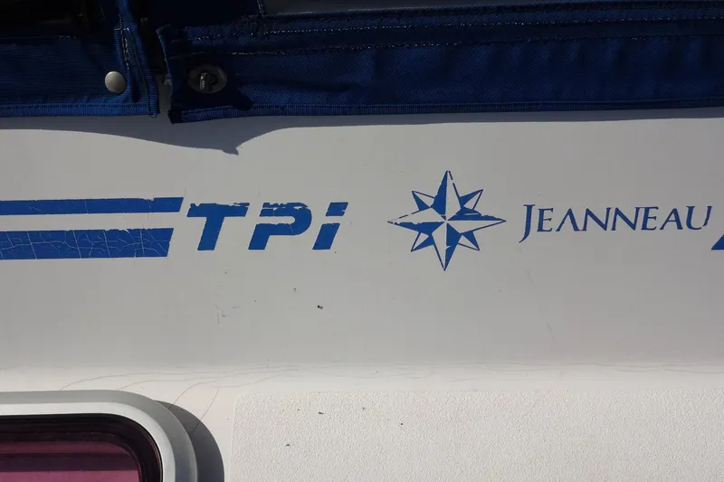 Slide: The Image of Close-up of 1996 Lagoon 35 CCC boat with TPI and Jeanneau logos. - 36