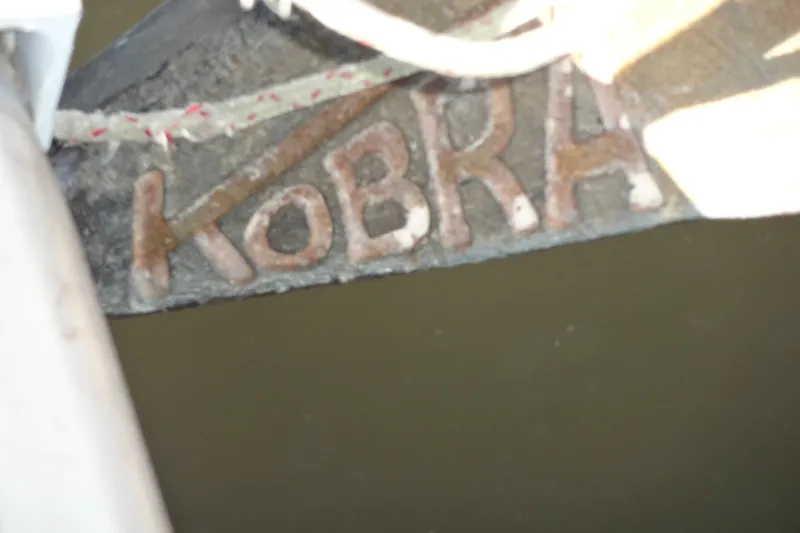 Slide: The Image of Close-up of a boat's name "KOBRA" on a 1996 Lagoon 35 CCC. - 38
