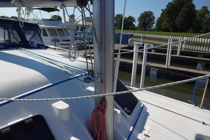 Slide: The Image of Sailboat deck of 1996 Lagoon 35 CCC with rigging and marina view. - 40