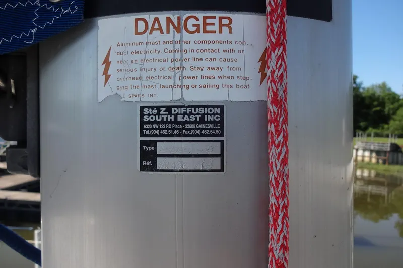 Slide: The Image of Warning label on Lagoon 35 CCC mast, highlighting electrical hazard, 1996 model. - 41