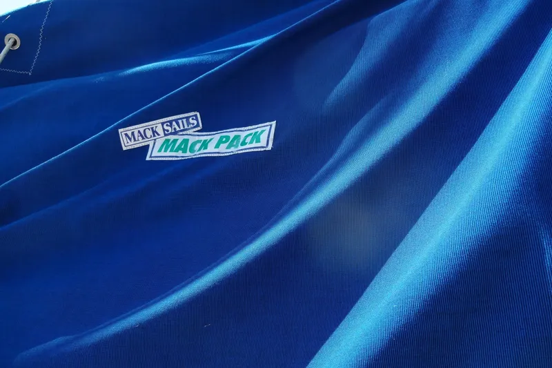 Slide: The Image of Blue sail with "Mack Sails Mack Pack" logo, Lagoon 35 CCC, 1996 model. - 42