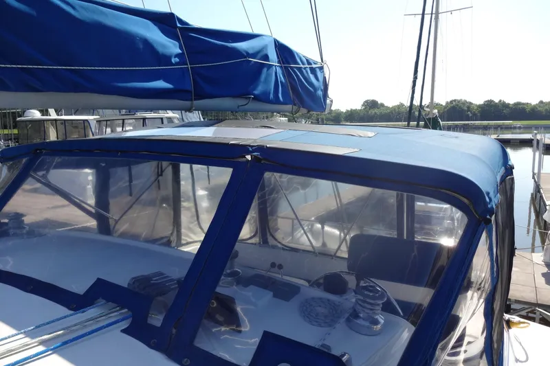 Slide: The Image of Sailboat cockpit of 1996 Lagoon 35 CCC with blue canopy and clear windows. - 43