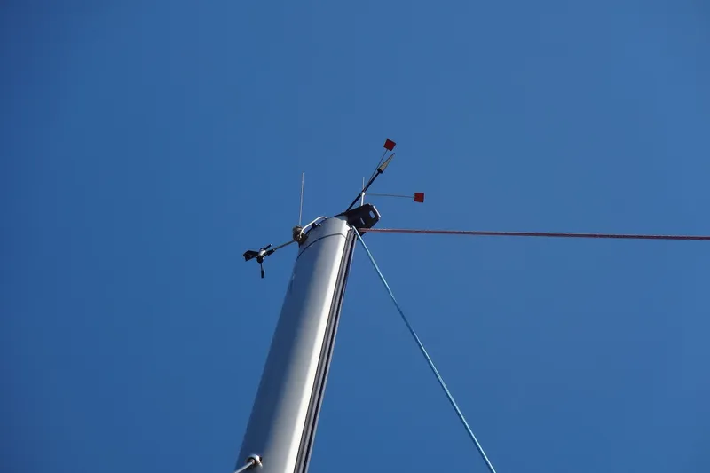 Slide: The Image of Mast of 1996 Lagoon 35 CCC sailboat against clear blue sky. - 48