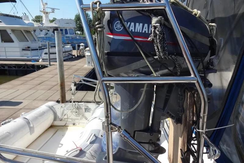 Slide: The Image of 1996 Lagoon 35 CCC sailboat with Yamaha outboard motor at marina dock. - 62