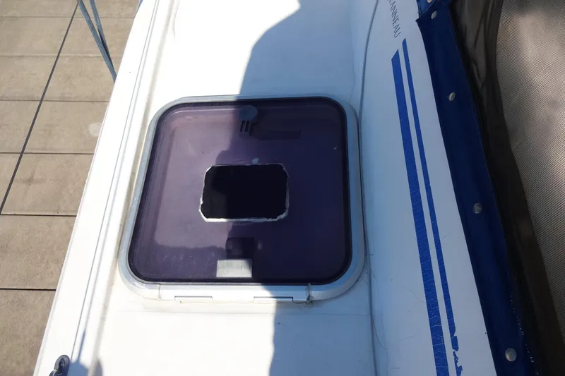 Slide: The Image of Hatch on 1996 Lagoon 35 CCC boat deck with shadow and blue trim. - 69