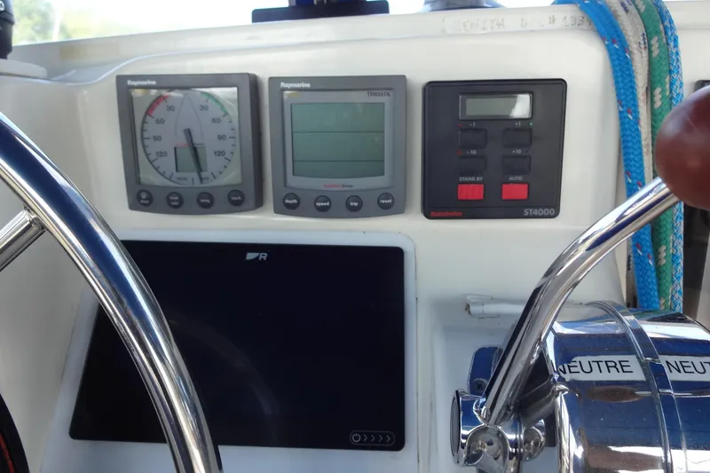 Slide: The Image of Cockpit controls of a 1996 Lagoon 35 CCC sailboat with navigation instruments. - 78