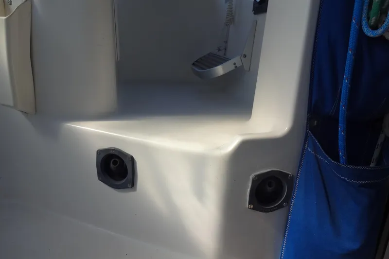 Slide: The Image of Interior view of a 1996 Lagoon 35 CCC sailboat with blue storage pocket. - 86