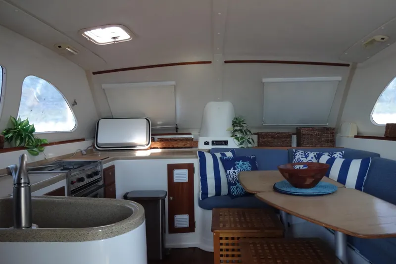 Slide: The Image of Interior of 1996 Lagoon 35 CCC yacht with cozy seating and modern kitchen area. - 87