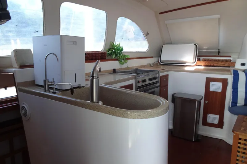 Slide: The Image of Interior of 1996 Lagoon 35 CCC yacht kitchen with modern appliances and sleek design. - 89