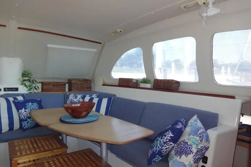 Slide: The Image of Interior of 1996 Lagoon 35 CCC yacht with cozy seating and nautical decor. - 90