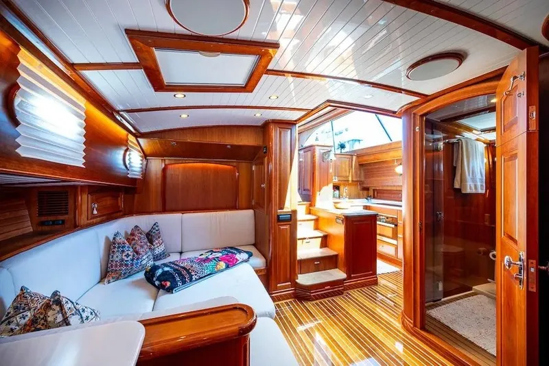 Slide: The Image of Luxurious interior of 2021 Hinckley Talaria 55 Flybridge MKII yacht with elegant wood finishes. - 34