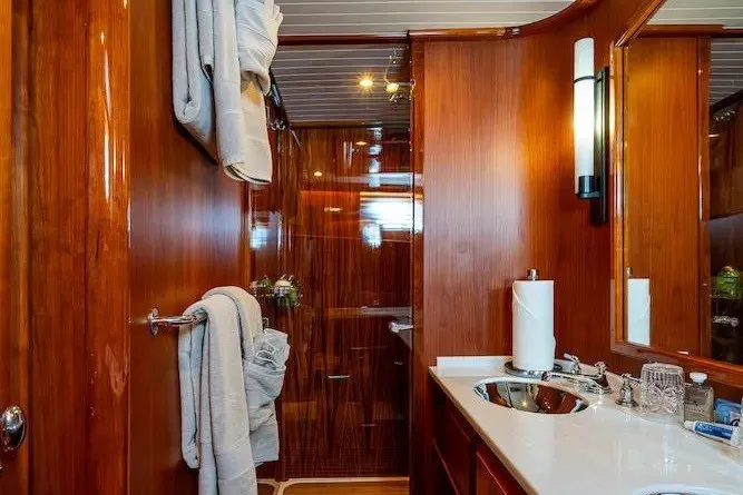 Slide: The Image of Luxurious bathroom interior of 2021 Hinckley Talaria 55 Flybridge MKII yacht with wooden finishes. - 29