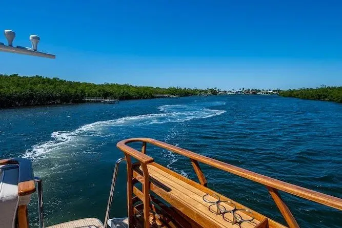 Slide: The Image of Hinckley Talaria 55 Flybridge MKII cruising on a sunny day, 2021 model. - 21