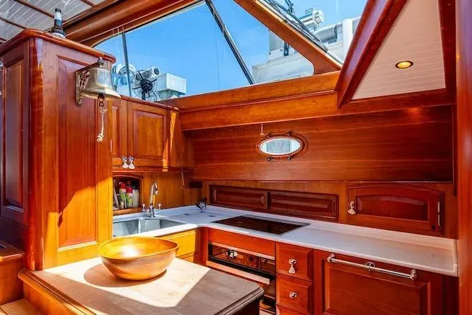 Slide: The Image of Luxurious wooden interior of 2021 Hinckley Talaria 55 Flybridge MKII yacht kitchen. - 36