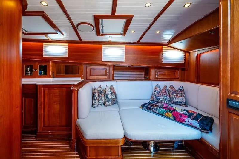 Slide: The Image of Luxurious interior of 2021 Hinckley Talaria 55 Flybridge MKII with elegant wood finish and cozy seating. - 33