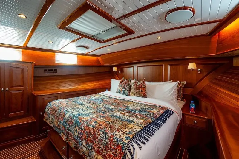 Slide: The Image of Luxurious cabin interior of 2021 Hinckley Talaria 55 Flybridge MKII with elegant wood finish. - 31
