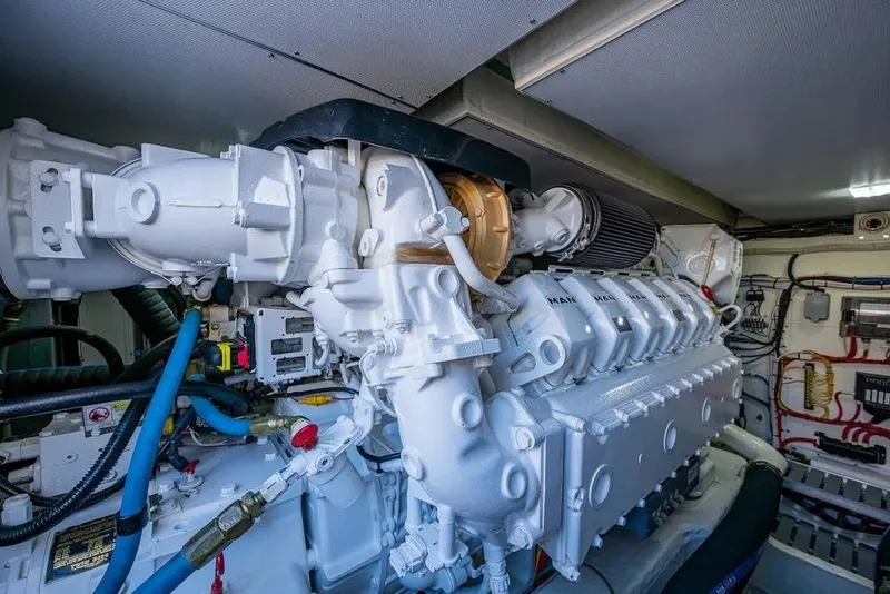 Slide: The Image of Engine room of 2021 Hinckley Talaria 55 Flybridge MKII yacht, showcasing powerful machinery. - 15