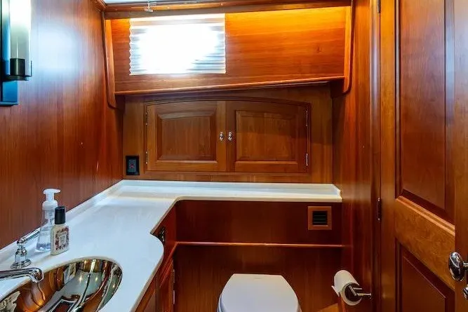 Slide: The Image of Luxurious wooden bathroom interior on 2021 Hinckley Talaria 55 Flybridge MKII yacht. - 30