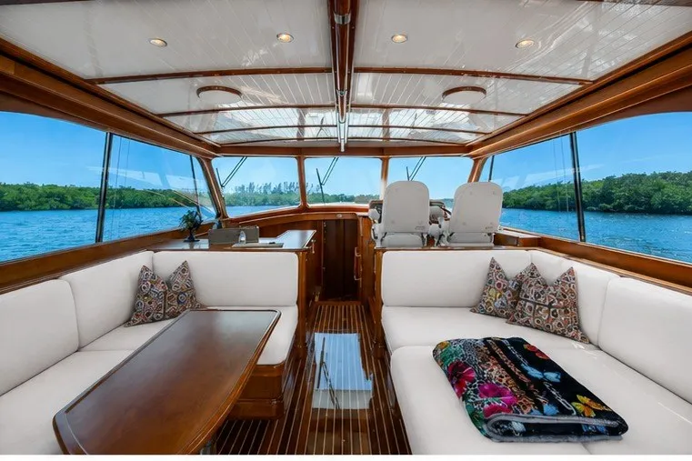 Slide: The Image of Luxurious interior of 2021 Hinckley Talaria 55 Flybridge MKII yacht with elegant seating and scenic views. - 25