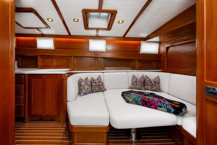 Slide: The Image of Luxurious interior of 2021 Hinckley Talaria 55 Flybridge MKII with elegant wood finish and plush seating. - 35