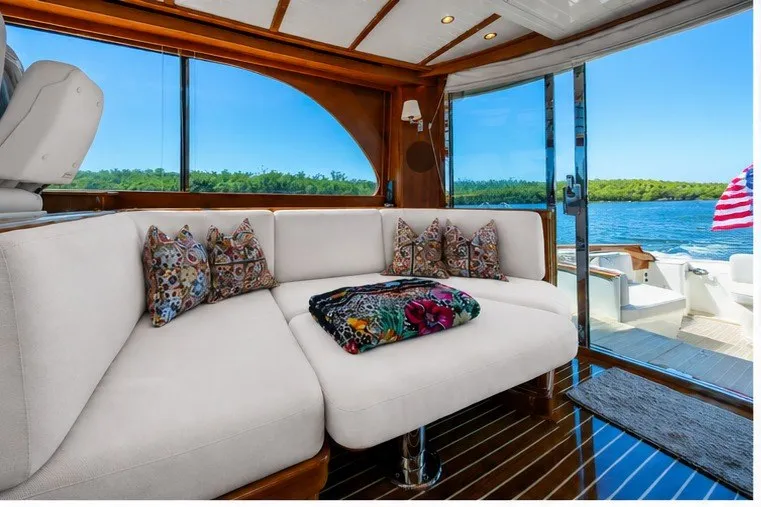 Slide: The Image of Luxurious interior of 2021 Hinckley Talaria 55 Flybridge MKII yacht with scenic water view. - 24