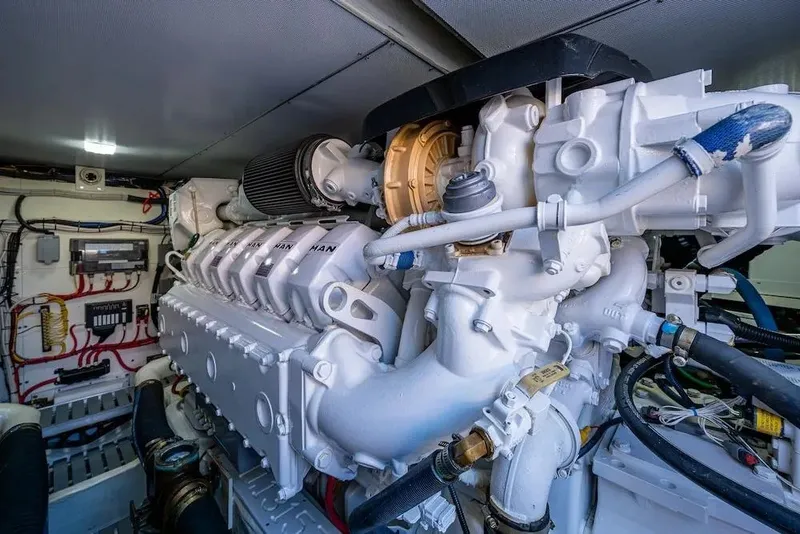 Slide: The Image of Engine room of 2021 Hinckley Talaria 55 Flybridge MKII yacht, showcasing detailed machinery. - 16