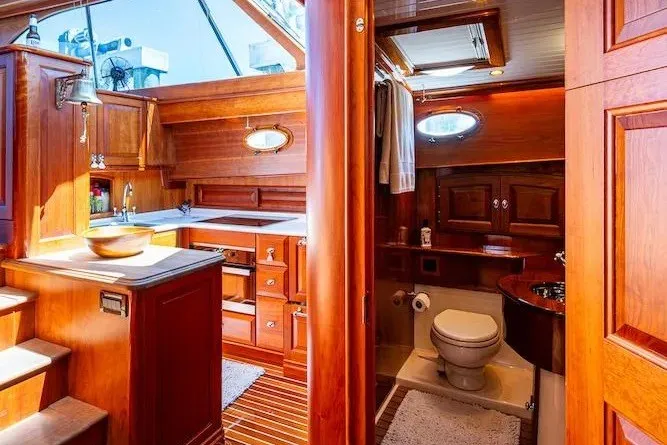 Slide: The Image of Luxurious wooden interior of 2021 Hinckley Talaria 55 Flybridge MKII yacht kitchen and bathroom. - 38